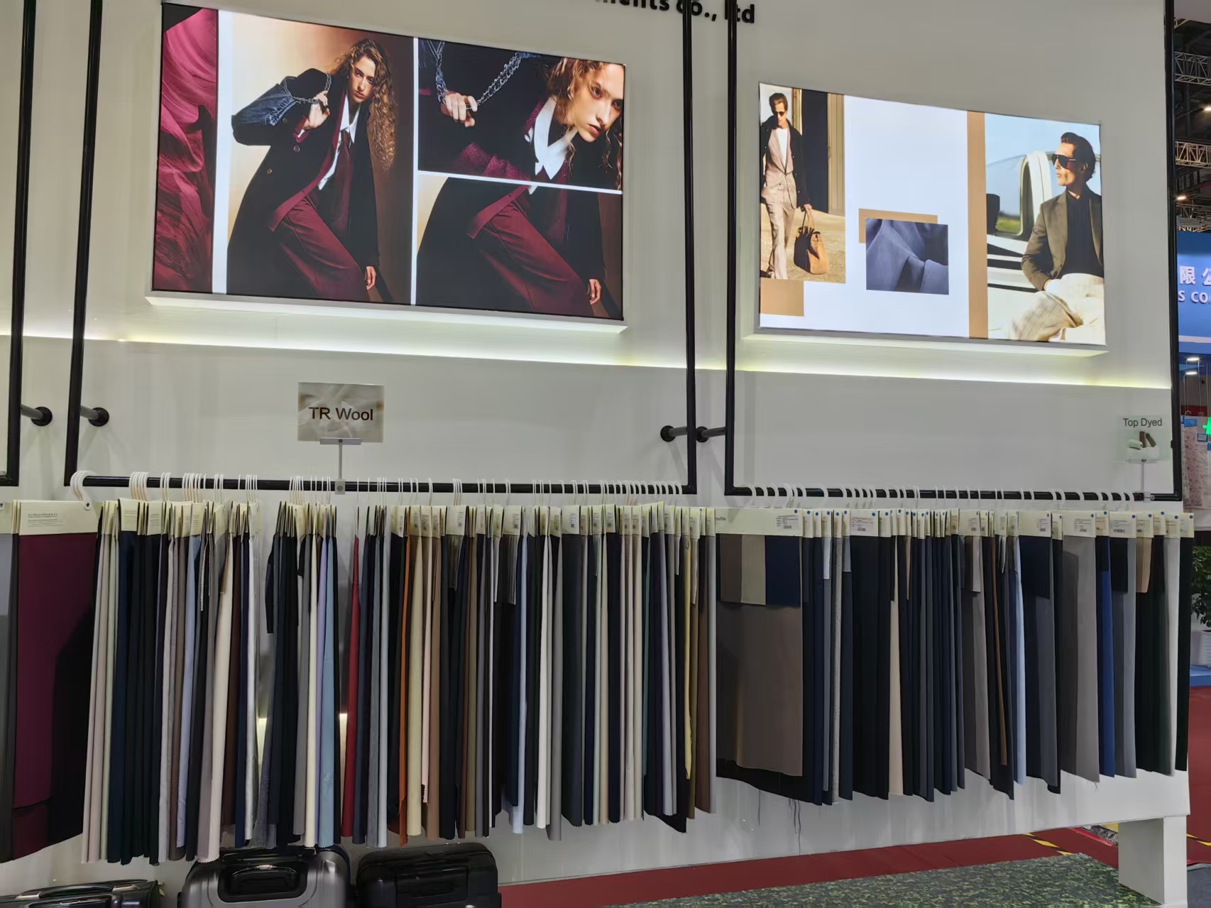 Second lookbook wall display with fabric rack below